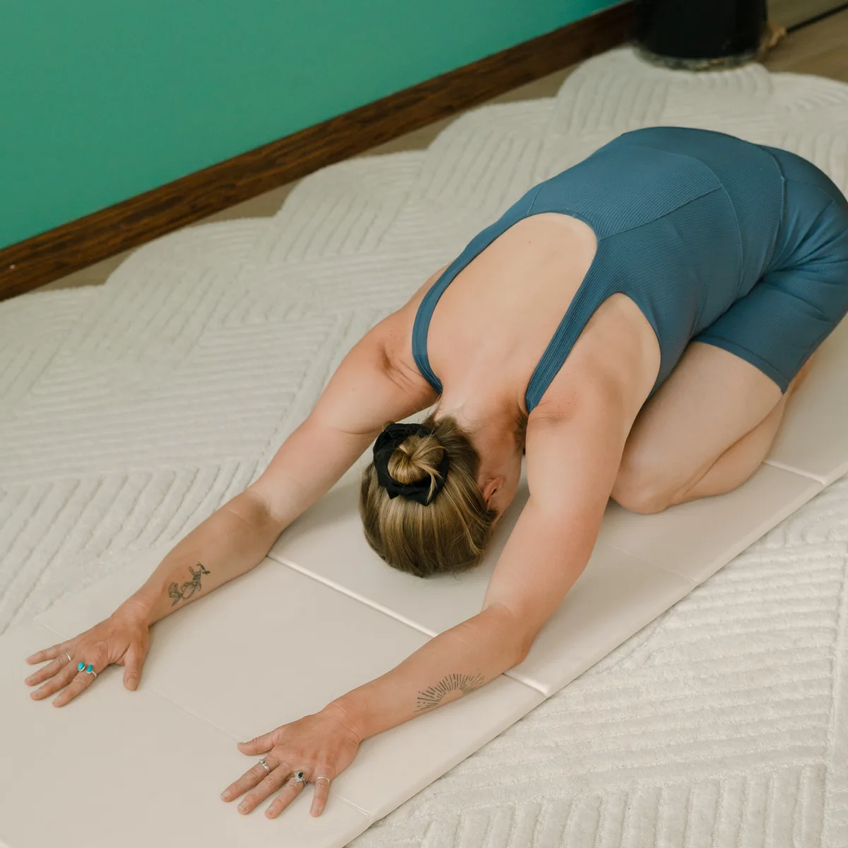 Marissa in a restorative movement pose
